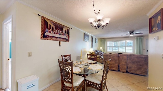 dining space with a textured ceiling, ceiling fan with notable chandelier, and ornamental molding