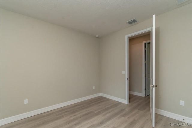 empty room featuring light hardwood / wood-style floors