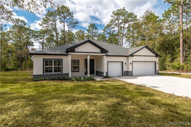 view of front of home with a garage and a front yard