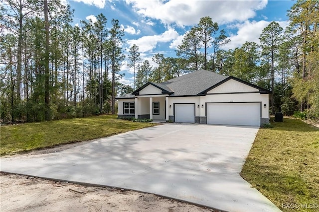 view of front of property with a garage and a front lawn