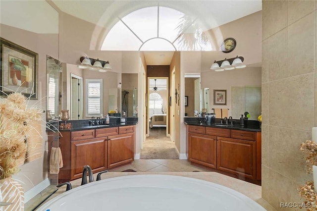 bathroom with vanity and lofted ceiling