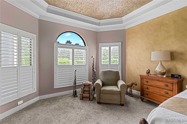 bedroom with light colored carpet, a raised ceiling, and crown molding