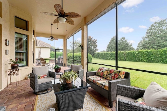 sunroom / solarium with ceiling fan