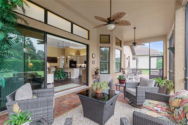 sunroom / solarium with ceiling fan