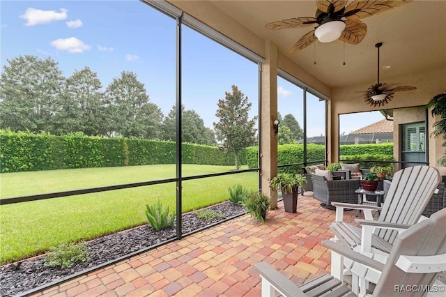 sunroom / solarium with ceiling fan