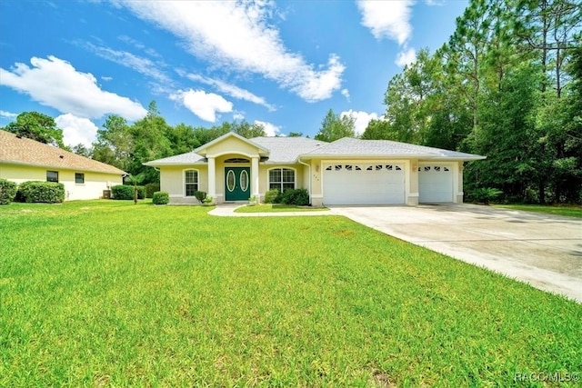 374 W Wason St, Citrus Springs, FL 34434 - single story home with an attached garage, concrete driveway, a front yard, and stucco siding