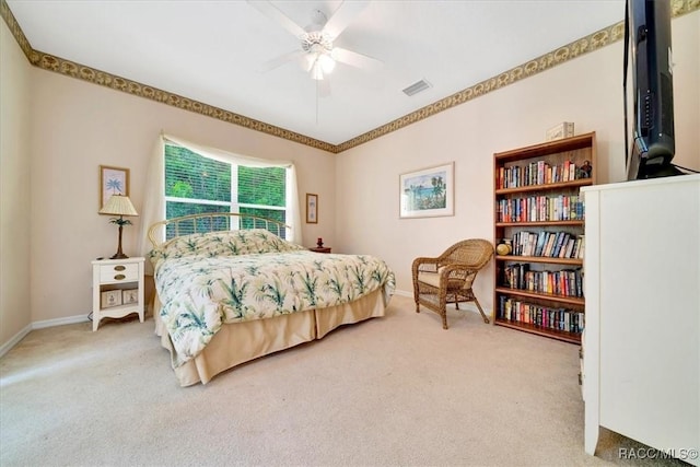 374 W Wason St, Citrus Springs, FL 34434 - carpeted bedroom with baseboards and a ceiling fan