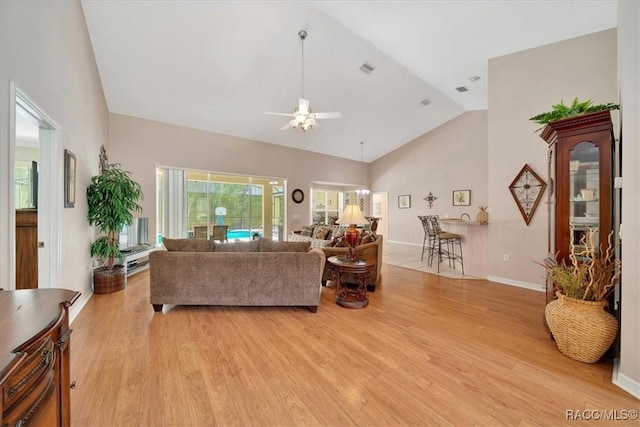 374 W Wason St, Citrus Springs, FL 34434 - living room with ceiling fan, light wood-style floors, and high vaulted ceiling