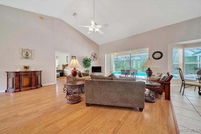 374 W Wason St, Citrus Springs, FL 34434 - living area featuring high vaulted ceiling, plenty of natural light, ceiling fan, and light wood-style flooring