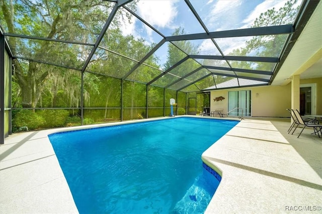 374 W Wason St, Citrus Springs, FL 34434 - outdoor pool featuring a patio and glass enclosure
