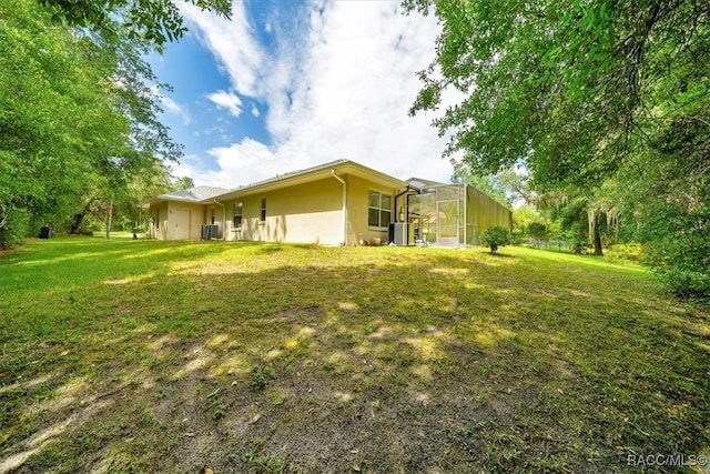 374 W Wason St, Citrus Springs, FL 34434 - view of grassy yard with a lanai