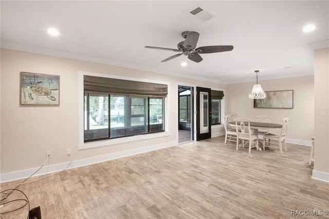 unfurnished living room with visible vents, baseboards, light wood-type flooring, ornamental molding, and recessed lighting