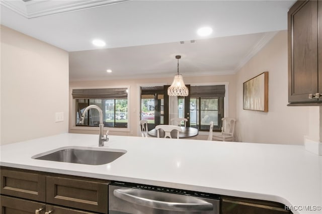 kitchen featuring visible vents, a sink, crown molding, light countertops, and dishwasher