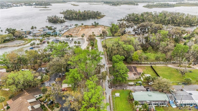 birds eye view of property featuring a water view and a residential view