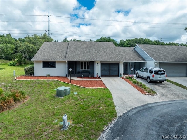 single story home featuring a front lawn