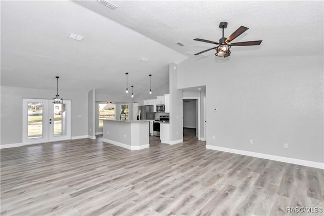4065 SW 5th Ave, Ocala, FL 34471 - unfurnished living room featuring french doors, sink, a textured ceiling, light wood-type flooring, and ceiling fan