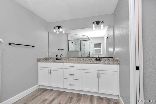 4065 SW 5th Ave, Ocala, FL 34471 - bathroom with walk in shower, vanity, and hardwood / wood-style floors