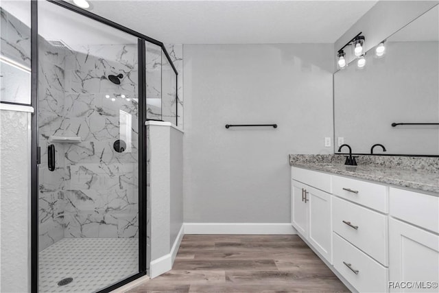 4065 SW 5th Ave, Ocala, FL 34471 - bathroom with an enclosed shower, vanity, and hardwood / wood-style flooring