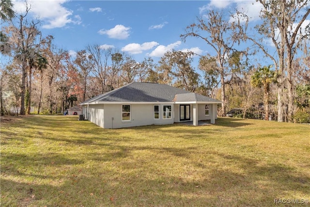 4065 SW 5th Ave, Ocala, FL 34471 - back of property featuring a lawn