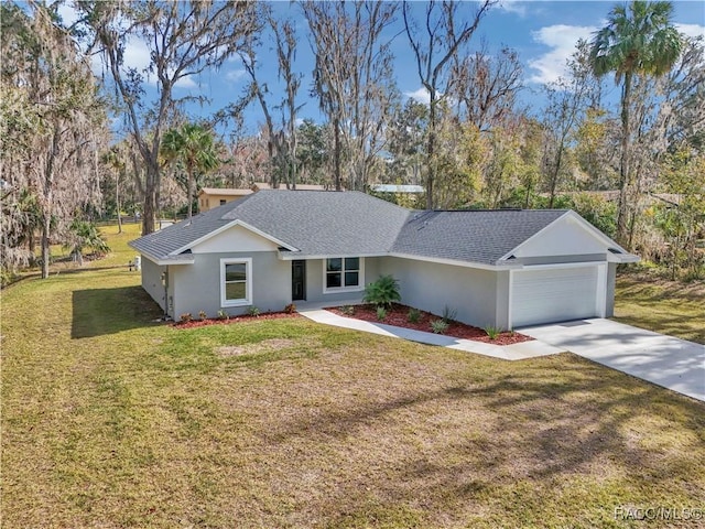 ranch-style home with a garage and a front lawn