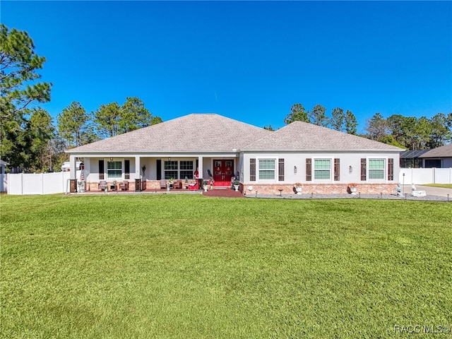 single story home featuring a front yard