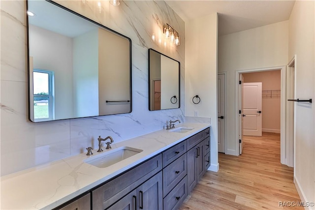 783 E Alaska Ln, Hernando, FL 34442 - bathroom with double vanity, wood finished floors, and a walk in closet