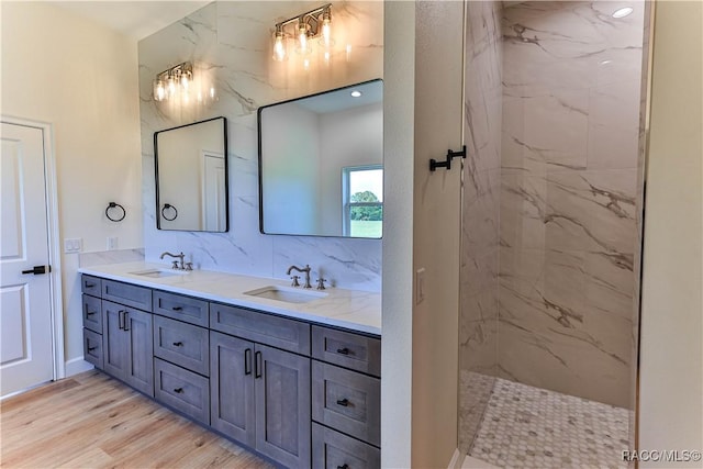 783 E Alaska Ln, Hernando, FL 34442 - full bath with double vanity, a marble finish shower, wood finished floors, and decorative backsplash