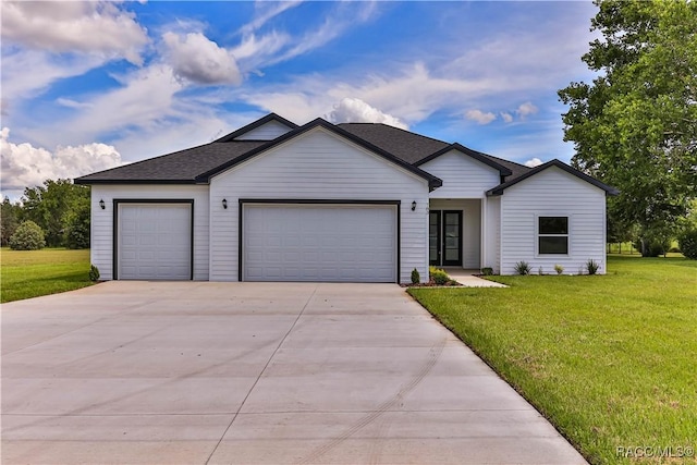 783 E Alaska Ln, Hernando, FL 34442 - view of front facade featuring an attached garage, concrete driveway, a front yard, and roof with shingles