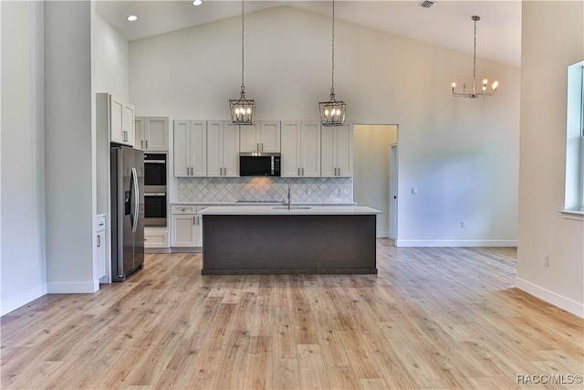 783 E Alaska Ln, Hernando, FL 34442 - kitchen featuring appliances with stainless steel finishes, high vaulted ceiling, a chandelier, light countertops, and decorative backsplash