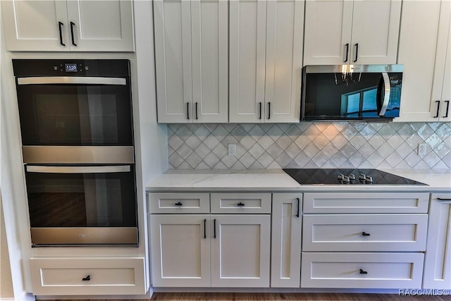 783 E Alaska Ln, Hernando, FL 34442 - kitchen featuring appliances with stainless steel finishes, decorative backsplash, and light stone counters