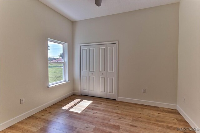 783 E Alaska Ln, Hernando, FL 34442 - unfurnished bedroom featuring light wood-style floors, a closet, and a ceiling fan