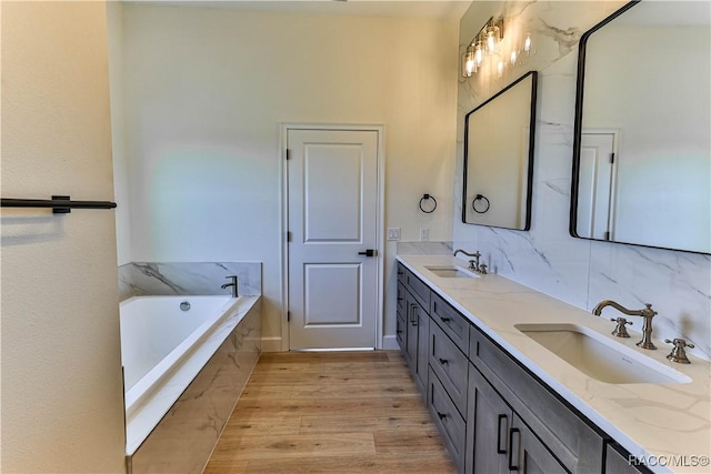 783 E Alaska Ln, Hernando, FL 34442 - full bath with double vanity, a garden tub, and wood finished floors
