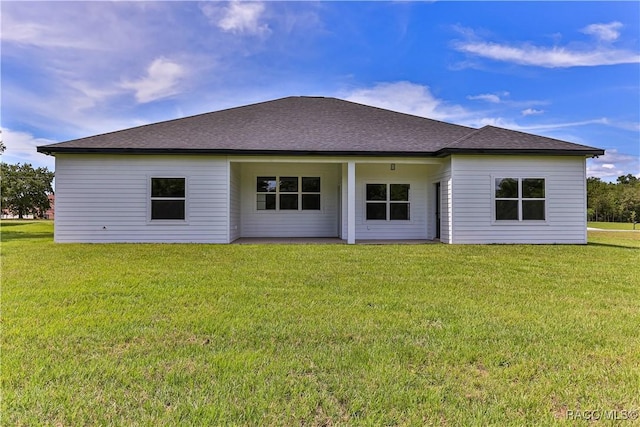 783 E Alaska Ln, Hernando, FL 34442 - rear view of property with a yard and roof with shingles