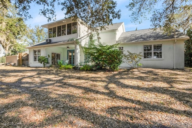 back of house with ceiling fan