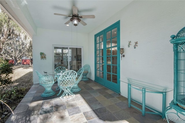 view of patio with french doors and ceiling fan