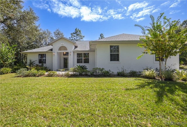 ranch-style home featuring a front yard