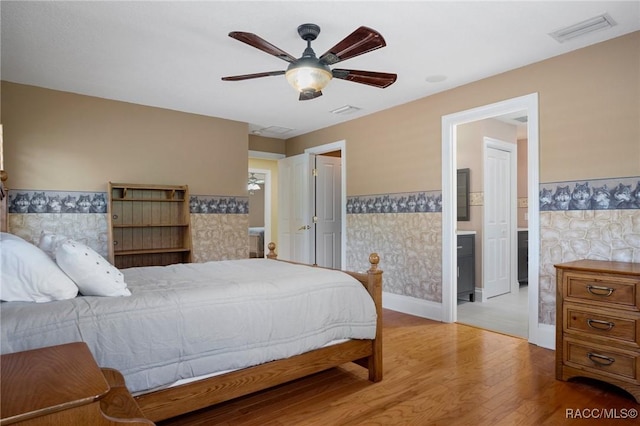 4160 W Bonanza Dr, Beverly Hills, FL 34465 - bedroom with wainscoting, wood finished floors, and ceiling fan