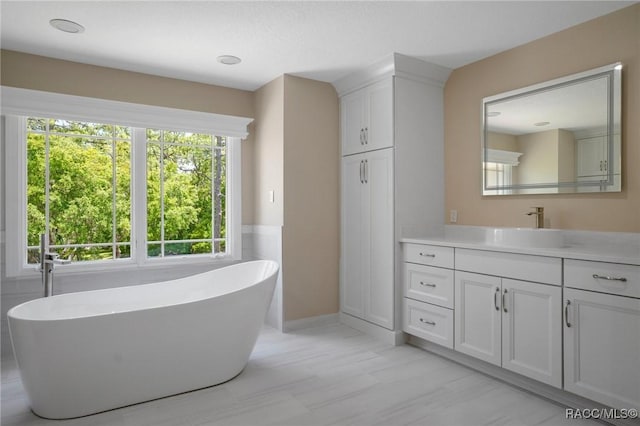 4160 W Bonanza Dr, Beverly Hills, FL 34465 - bathroom featuring vanity and a freestanding bath