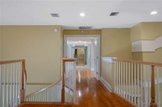 4160 W Bonanza Dr, Beverly Hills, FL 34465 - hall featuring an upstairs landing, wood finished floors, and recessed lighting