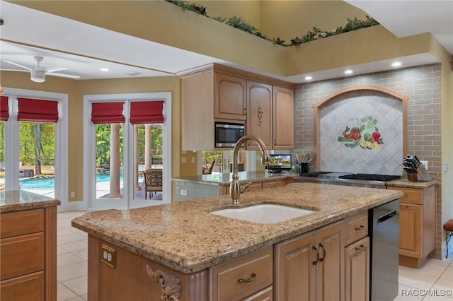 4160 W Bonanza Dr, Beverly Hills, FL 34465 - kitchen featuring a sink, light tile patterned floors, stainless steel appliances, decorative backsplash, and ceiling fan