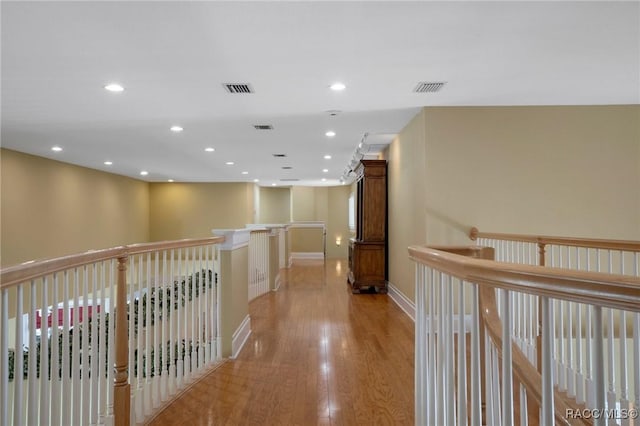 4160 W Bonanza Dr, Beverly Hills, FL 34465 - hallway featuring light wood-style flooring, recessed lighting, baseboards, and an upstairs landing