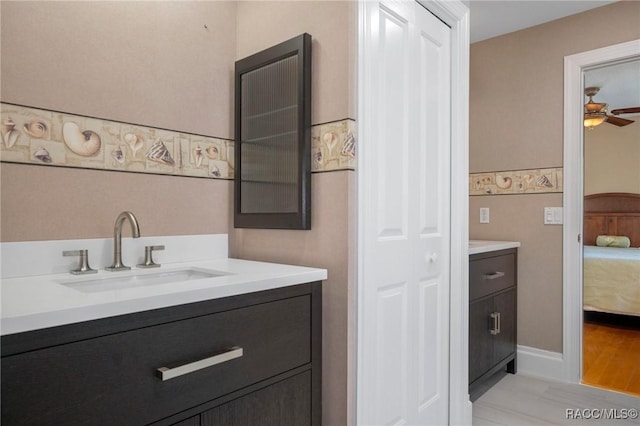 4160 W Bonanza Dr, Beverly Hills, FL 34465 - washroom with a sink, light wood finished floors, and ceiling fan