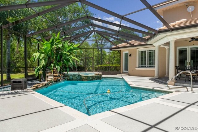 4160 W Bonanza Dr, Beverly Hills, FL 34465 - view of swimming pool with a patio area, a pool with connected hot tub, a ceiling fan, a lanai, and french doors