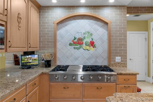4160 W Bonanza Dr, Beverly Hills, FL 34465 - kitchen featuring stainless steel gas stovetop, decorative backsplash, light stone counters, light tile patterned floors, and recessed lighting