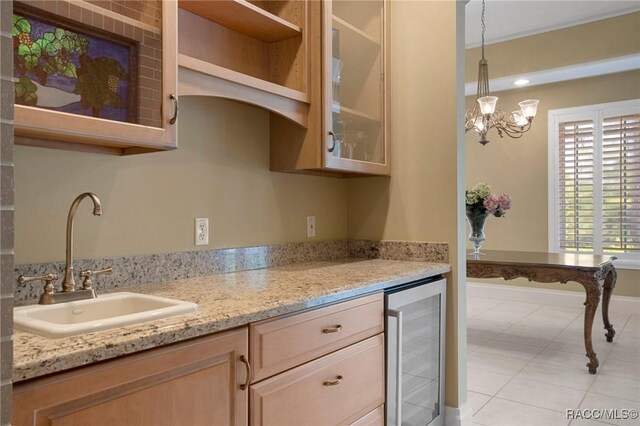 4160 W Bonanza Dr, Beverly Hills, FL 34465 - kitchen featuring beverage cooler, a sink, glass insert cabinets, and pendant lighting