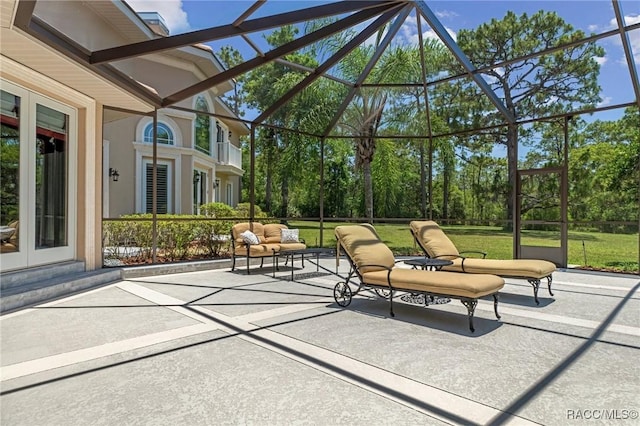 4160 W Bonanza Dr, Beverly Hills, FL 34465 - view of patio / terrace with an outdoor living space, view of wooded area, and a lanai