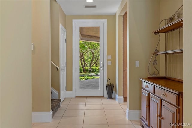 4160 W Bonanza Dr, Beverly Hills, FL 34465 - doorway to outside with stairs, light tile patterned floors, and baseboards