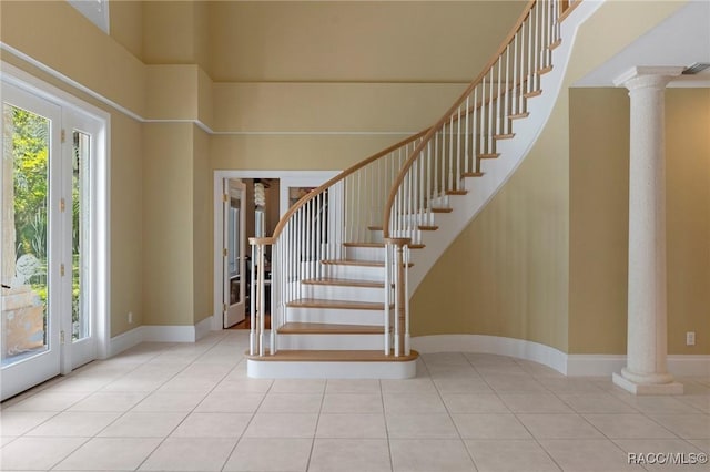 4160 W Bonanza Dr, Beverly Hills, FL 34465 - tiled foyer with ornate columns, stairway, and baseboards