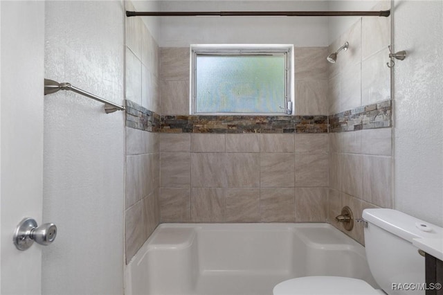 full bathroom featuring toilet and bathing tub / shower combination