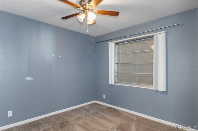 empty room with a ceiling fan, baseboards, and carpet floors